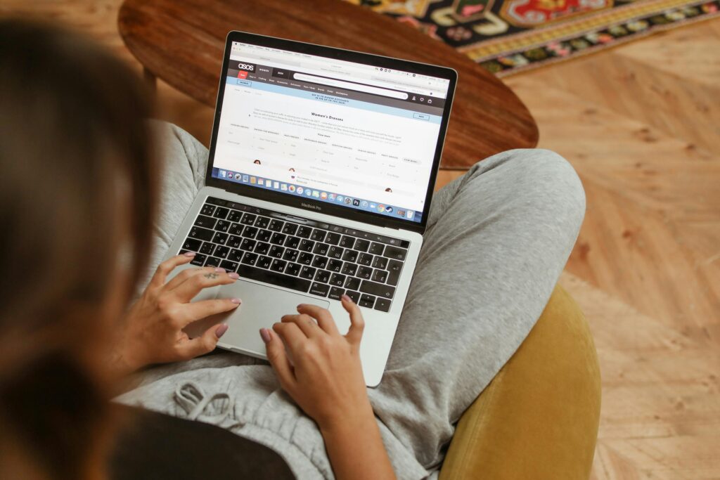 image of laptop screen on woman's lap. every website needs legal policies